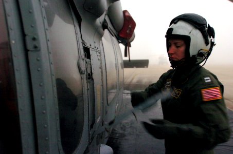 US Navy 060113-N-9866B-007 Lt. Jessica Parker, a MH-60S Seahawk helicopter pilot, does an early morning pre-flight check on the flight line of Naval Air Station North Island