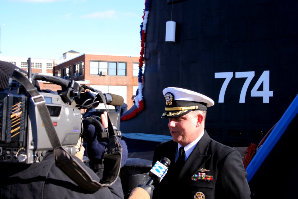 US Navy 051123-N-0653J-003 Commanding Officer, USS Virginia (SSN 774), Cmdr. Todd Cramer, answers questions from local media about his submarine