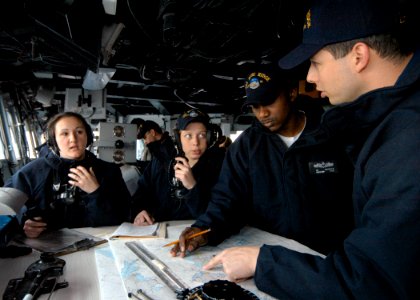US Navy 060118-N-7526R-057 USS Blue Ridge (LCC 19) Navigation Officer, Lt. Cmdr. Ed Aruffo aids his Sea and Anchor navigation team as Blue Ridge gets underway photo