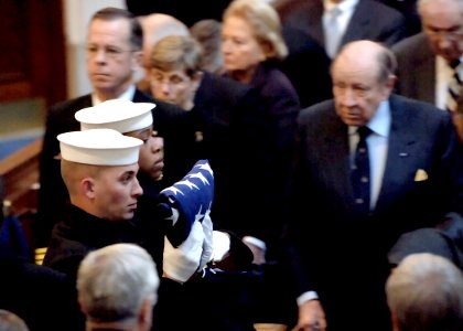 US Navy 051214-N-5390M-001 Chief of Naval Operations Adm. Mike Mullen and retired Adm. William Crowe look on as the honor guard leaves the U.S. Naval Academy Chapel during the interment ceremony of retired Vice Adm. William P