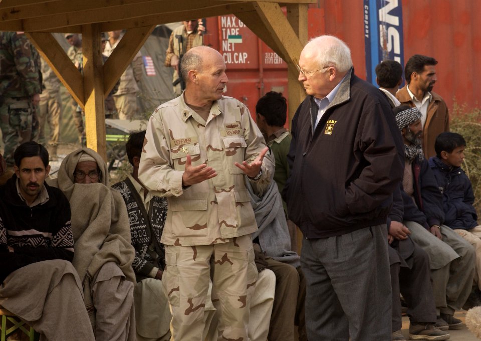 US Navy 051220-F-2729L-003 Commander of Disaster Assistance Center Pakistan, Rear Adm. Michael Lefever, speaks to U.S. Vice President Dick Cheney at the 212th Mobile Army Surgical Hospital in Muzaffarabad