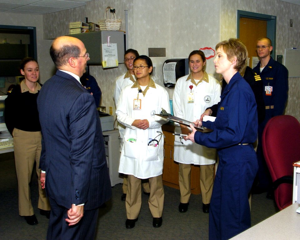 US Navy 060104-N-2568S-003 Secretary of the Navy, the Honorable Dr. Donald Winter meets with staff members at the National Naval Medical Center, during a visit with wounded Sailors and Marines
