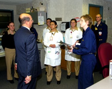 US Navy 060104-N-2568S-003 Secretary of the Navy, the Honorable Dr. Donald Winter meets with staff members at the National Naval Medical Center, during a visit with wounded Sailors and Marines