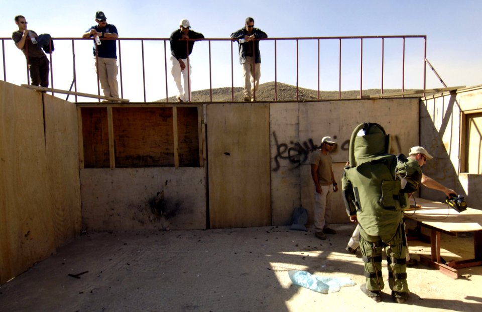US Navy 051218-F-7234P-062 Yemen Explosive Ordinance Disposal (EOD) team members, watch as Chief Petty Officer Zach Holzhausen shows the proper way of taking an x-ray of an Improvised Explosive Device (IED) during a training sc
