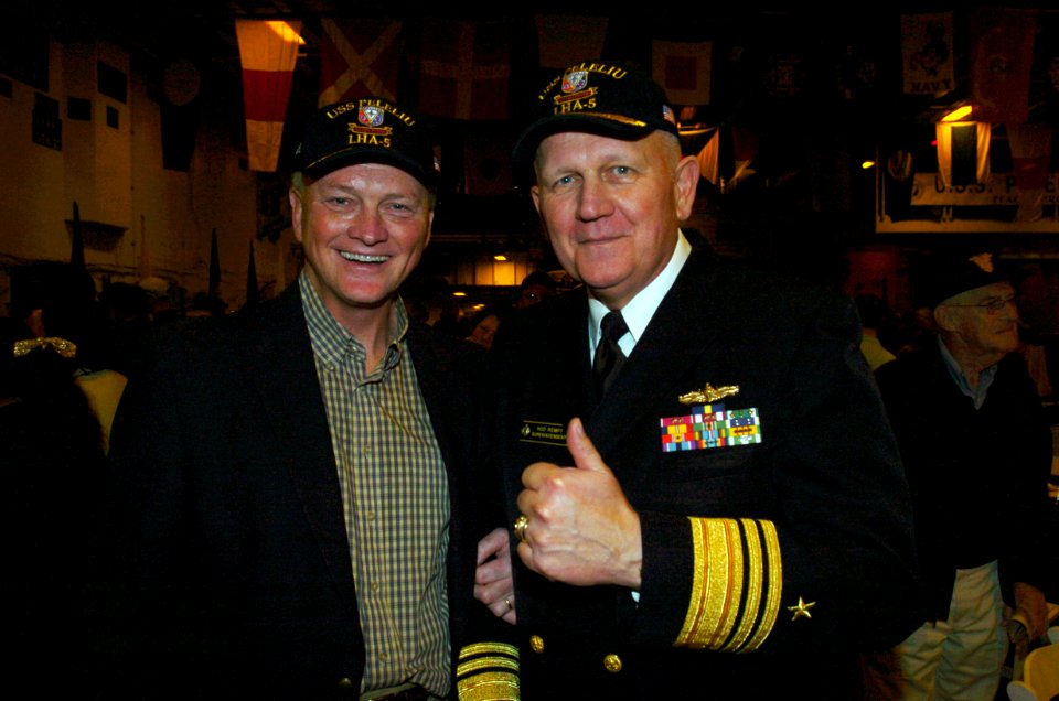 US Navy 051221-N-9866B-751 U.S. Naval Academy Superintendent Vice Adm. Rodney Rempt and Naval Academy Director of Athletics Chet Gladchuk cheer during a pep rally