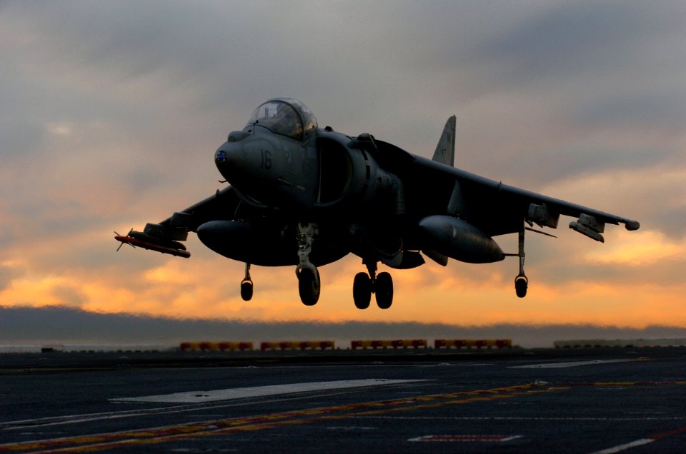 US Navy 051210-N-9866B-213 An AV-8B Harrier lands on the flight deck of the amphibious assault ship USS Peleliu (LHA 5)