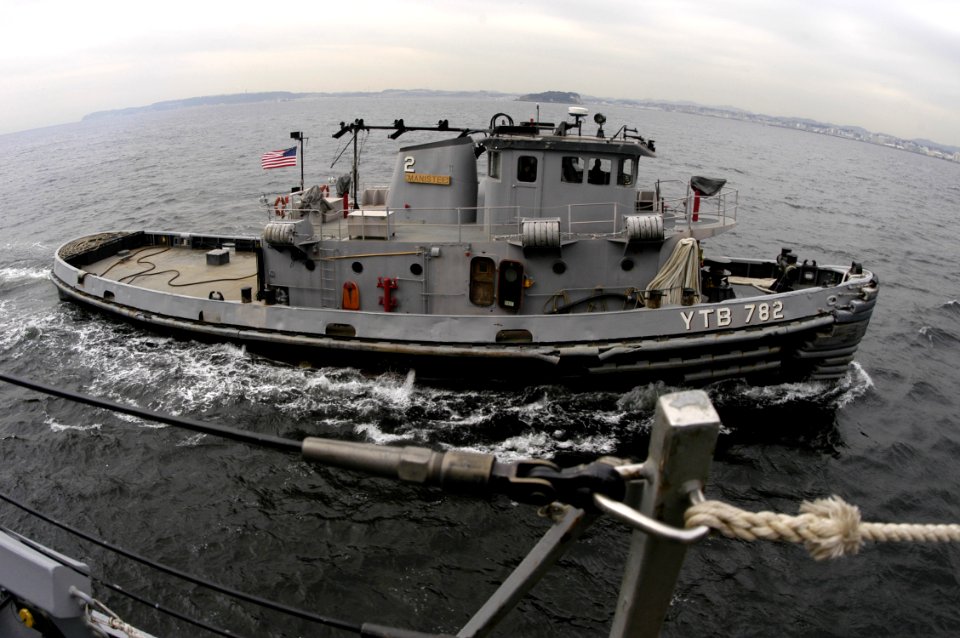 US Navy 060113-N-2385R-049 A Yokosuka Naval tugboat (YTB 782) prepares to assist the guided missile destroyer USS Curtis Wilbur (DDG 54)