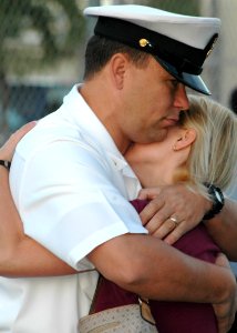 US Navy 060105-N-3019M-001 Chief Cryptological Technician Will Rodgers hugs his wife on the pier before departing aboard the guided missile destroyer USS Chung-Hoon (DDG 93) photo