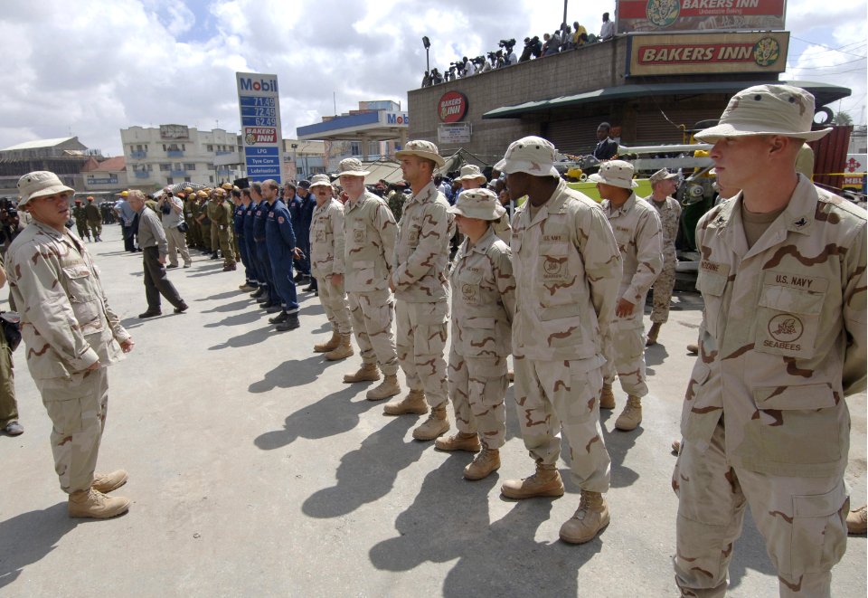 US Navy 060126-F-2902B-060 U.S. Navy Seabees prepare to take part in a memorial service for those killed in a building that collapsed on Nairobi's Ronald Ngala Street Kenya, Africa