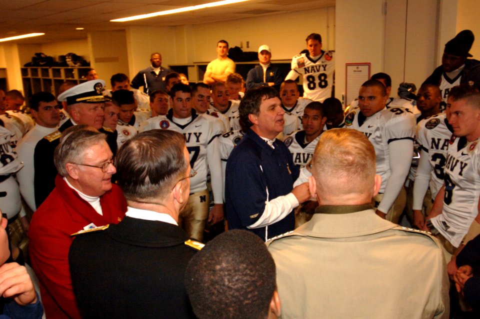 US Navy 051203-N-9693M-671 Navy coach Paul Johnson congratulates the team following a 42-23 victory over the Black Knights of Army