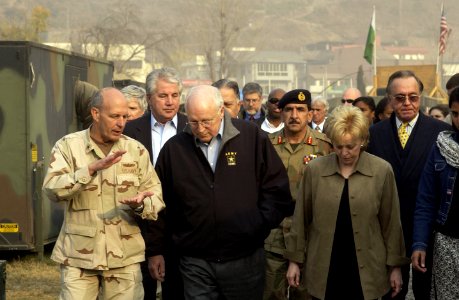 US Navy 051220-F-2729L-007 Commander of Disaster Assistance Center Pakistan, Rear Adm. Michael Lefever, speaks to U.S. Vice President Dick Cheney at the 212th Mobile Army Surgical Hospital in Muzaffarabad photo