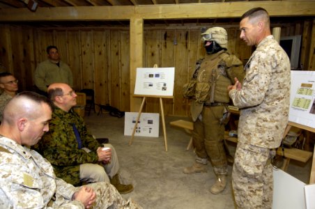 US Navy 060128-N-2568S-003 Secretary of the Navy (SECNAV) Dr. Donald C. Winter receives a briefing from Lt. Col. Chris Wagner on the personal protective gear worn by Marines operating in Iraqi
