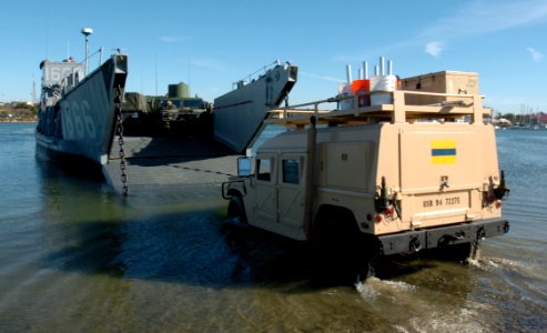 US Navy 051205-N-9866B-211 A U.S. Marine Corps truck drives onto Landing Craft Utility One Six Six Six (LCU-1666) assigned to Amphibious Craft Unit One (ACU-1) based at Naval Amphibious Base Coronado, Calif