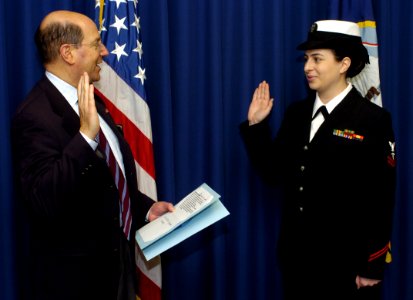 US Navy 060113-N-2568S-017 Secretary of the Navy (SECNAV) Dr. Donald C. Winter administers the commissioning oath to Hospital Corpsman 2nd Class Elizabeth R. Angelo
