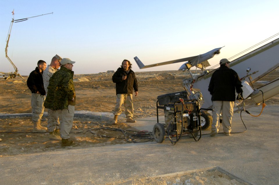 US Navy 060129-N-2568S-112 Secretary of the Navy (SECNAV), the Honorable Dr. Donald C. Winter, looks on as the Unmanned Aerial Vehicle Scan Eagle is prepared for launch