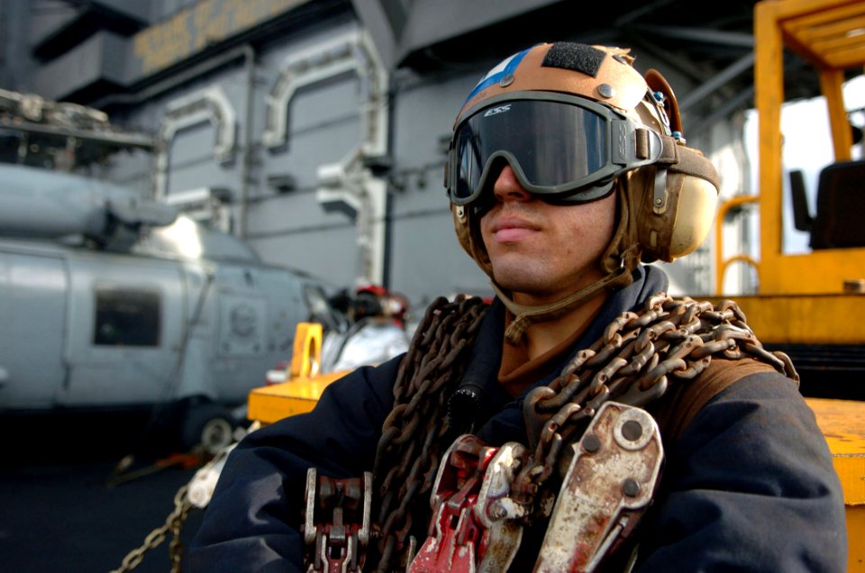 US Navy 051206-N-3488C-059 Airman Sean Casella waits for an F-A-18F Super Hornet o launch off the flight deck
