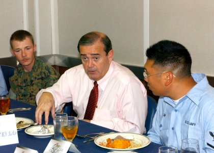 US Navy 060119-N-3293G-030 The Honorable Jerry F. Costello (D-IL) talks with Aviation Boatswain's Mate 3rd Class Michael Little and Sgt. Joseph Pruiett during a luncheon aboard the amphibious assault ship USS Tarawa (LHA 1)