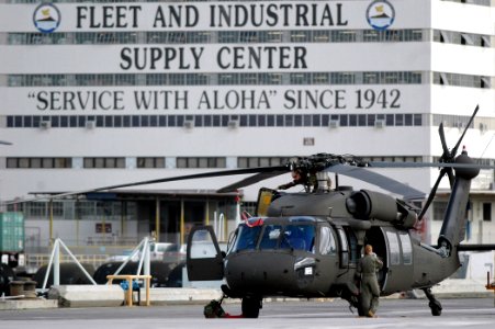US Navy 060117-N-3019M-002 A U.S. Army UH-60 Blackhawk helicopter prepares to take off from Fleet Industrial and Supply Center photo