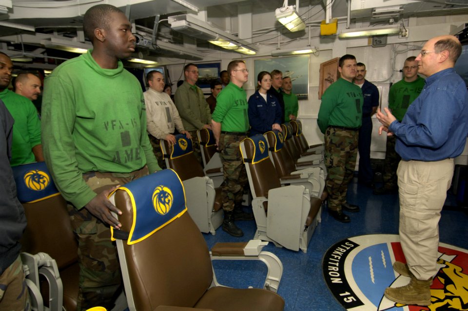 US Navy 060130-N-2568S-173 Secretary of the Navy (SECNAV), the Honorable Dr. Donald C. Winter, talks with Sailors from Strike Fighter Squadron Fifteen (VFA-15), aboard Nimitz-class aircraft carrier USS Theodore Roosevelt (CVN 7