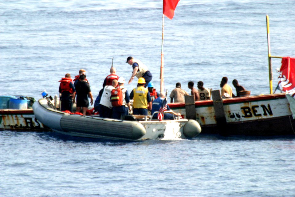 US Navy 060115-N-8637R-004 A rigid hull inflatable boat (RHIB) from the frigate USS Carr (FFG 52) assists a distressed vessel off the coast of Sierra Leone, Africa