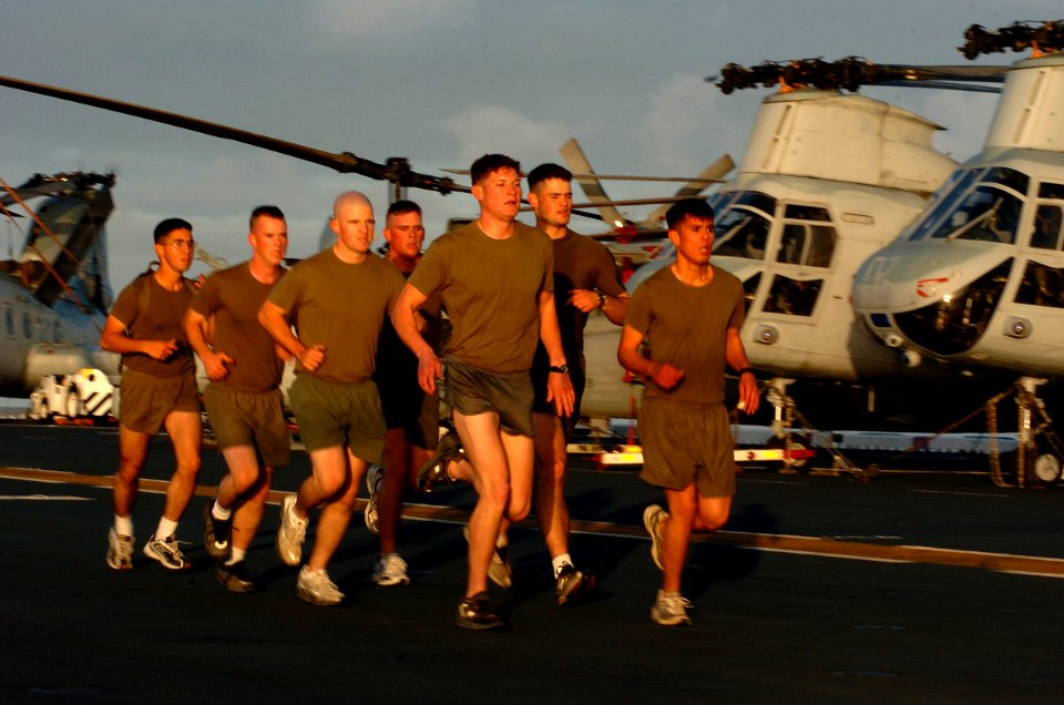 US Navy 060114-N-9866B-020 Marines assigned to the 11th Marine Expeditionary Unit (MEU) run in formation on the flight deck