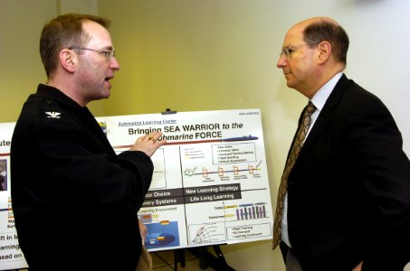 US Navy 060119-N-2568S-011 Commanding Officer Submarine School, Capt. Ken Swan explains to Secretary of the Navy (SECNAV), the Honorable, Dr. Donald C. Winter the various types of training the school provides