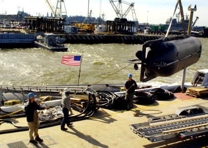 US Navy 060206-N-1464F-003 A SEAL Delivery Vehicle (SDV) is loaded aboard the Los Angeles-class fast attack submarine USS Dallas (SSN 700) in preparation for a Special Warfare Training exercise
