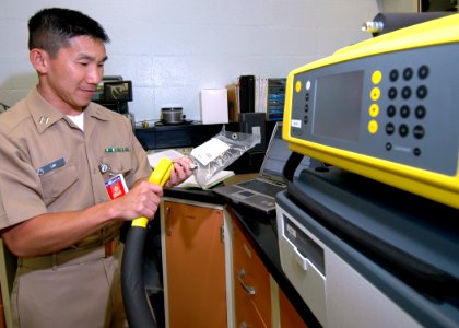 US Navy 060207-N-3019M-003 Lt. Kyle Lim, industrial hygiene officer assigned to Navy Environmental and Preventative Medicine Unit Six (NEPMU-6), tests an air sample for contaminants