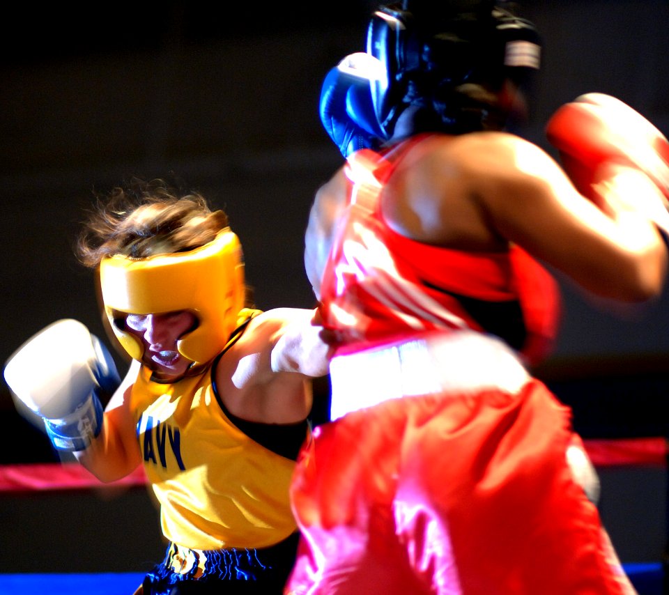 US Navy 060208-N-2653P-117 Information Systems Technician 2nd Class Triva Pino, left, assigned to the guided missile cruiser USS Port Royal (CG 73), won the 2006 U.S. Armed Forces Boxing Championship