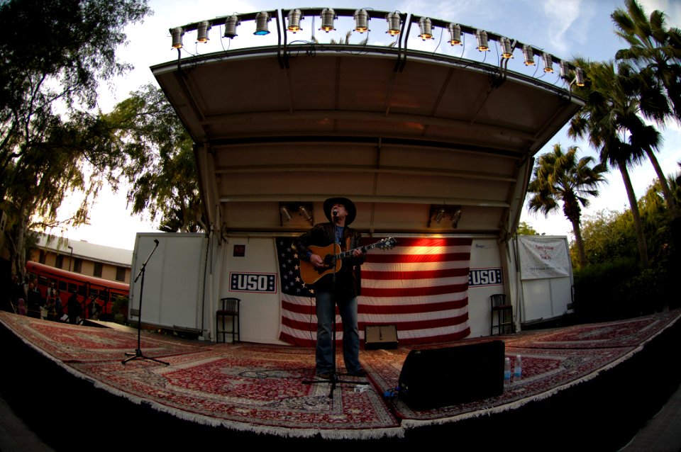 US Navy 051229-F-0193C-147 Country Music Singer Michael Peterson performs during a United Service Organization (USO) show in front of Sailors at Naval support facility, Bahrain