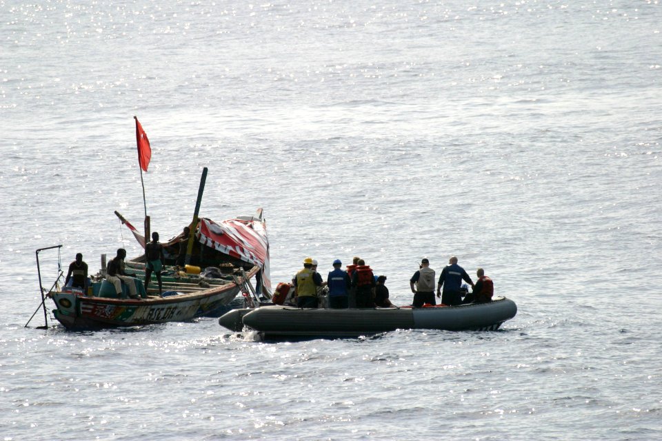 US Navy 060115-N-8637R-005 A rigid hull inflatable boat (RHIB) from the frigate USS Carr (FFG 52) assists a distressed vessel off the coast of Sierra Leone, Africa