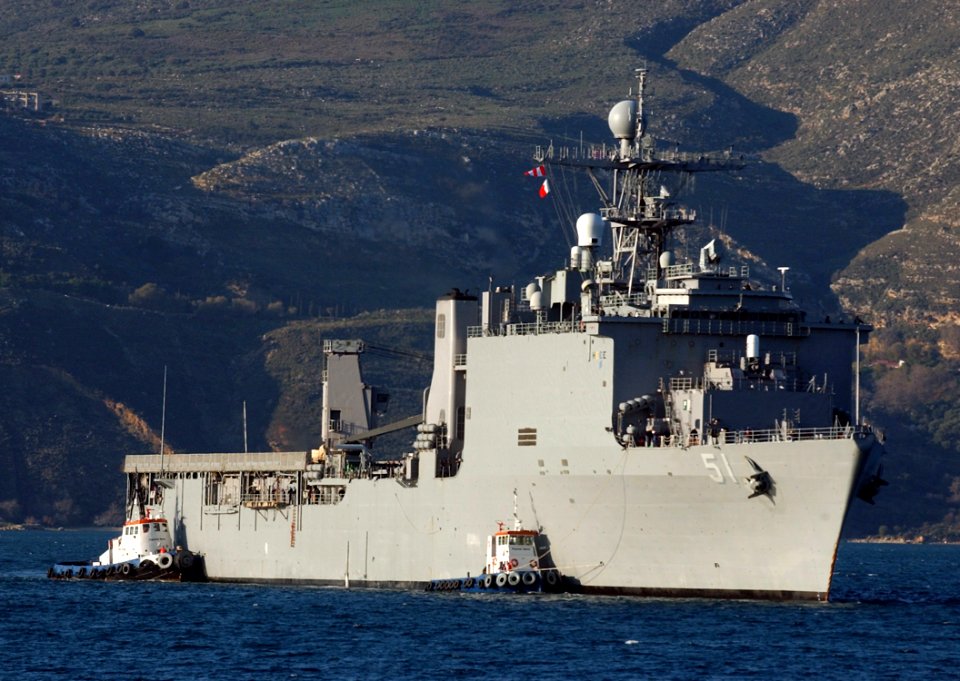 US Navy 060209-N-0780F-002 Tug boats assist the dock landing ship USS Oak Hill (LSD 51) as she arrives for a routine port visit to Greece's largest island