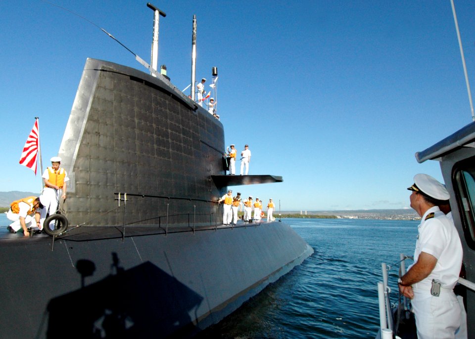 US Navy 060130-N-3019M-004 Commanding officer of the fast attack submarine USS Los Angeles (SSN 688) Cmdr. Thomas Stanley, observes the Japanese submarine Defense Ship (JDS) Oyashio