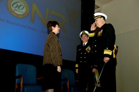 US Navy 060119-N-7676W-127 Rear Adm. William E. Landay, III salutes Assistant Secretary of the Navy for Research, Development and Acquisition, the Honorable Dr. Delores M. Etter photo