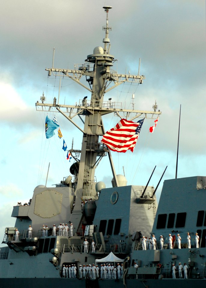US Navy 060105-N-3019M-007 Sailors man the rails aboard the guided missile destroyer USS Chung-Hoon (DDG 93), as she departs Pearl Harbor for a maiden five-month deployment in support of the global war on terrorism