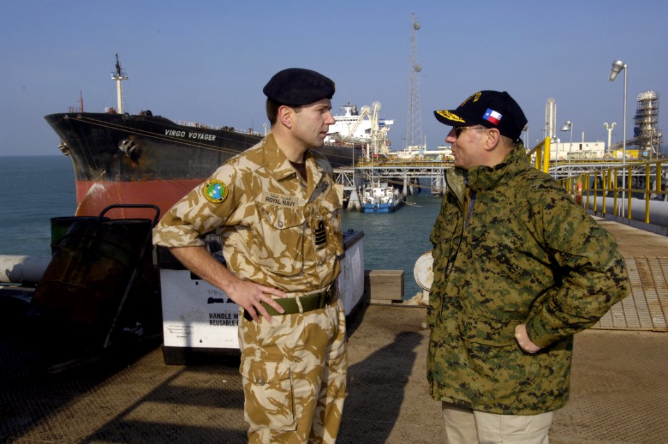 US Navy 060130-N-2568S-051 During the tour of an oil terminal in the Persian Gulf, Secretary of the Navy (SECNAV), the Honorable Dr. Donald C. Winter and Royal Navy Capt. Paddy McAlpine discuss the coalition efforts that are pr