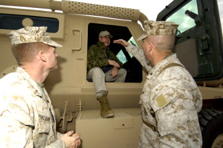 US Navy 060128-N-2568S-027 Brig. Gen. John Wissler (right) and Chief Warrant Officer Tim Callahan explain to Secretary of the Navy (SECNAV) Dr. Donald C. Winter, how the newly designed vehicles are helping to protect Marines