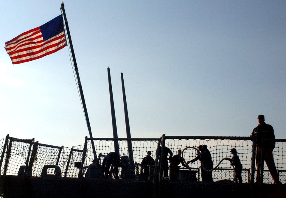 US Navy 060203-N-0780F-005 Sailors aboard the guided-missile destroyer USS Porter (DDG 78) handle lines during mooring operations upon their arrival for a routine port visit