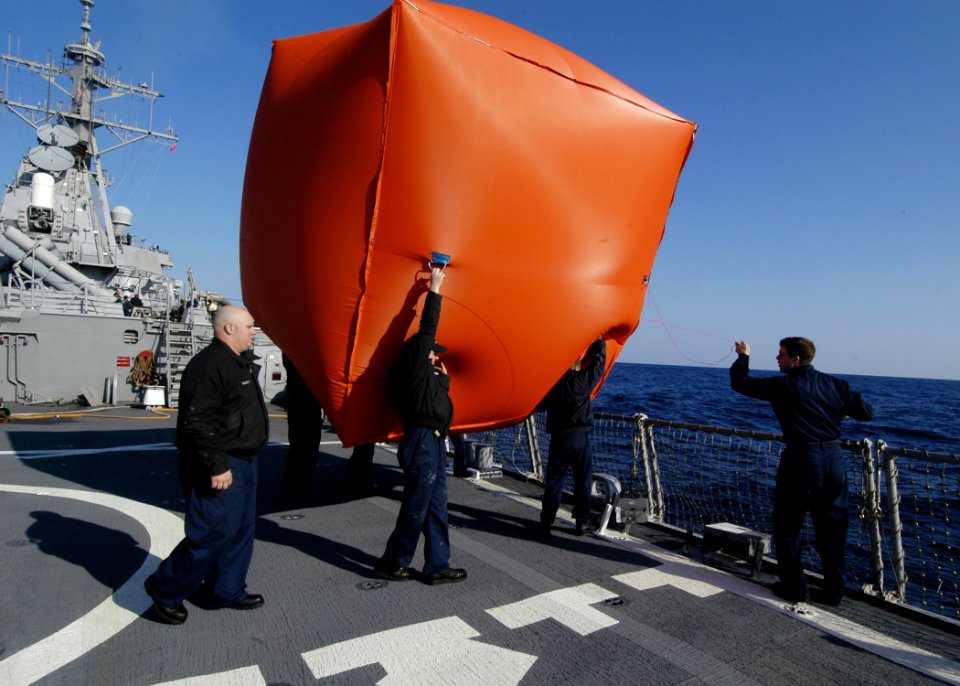 US Navy 060112-N-2385R-152 Sailors launch a killer tomato prior to executing a live fire exercise
