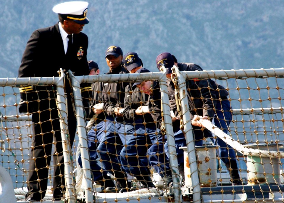 US Navy 060208-N-0780F-007 Sailors assigned to the guided-missile destroyer USS Roosevelt (DDG 80) conduct mooring operations as they arrive for a routine port visit