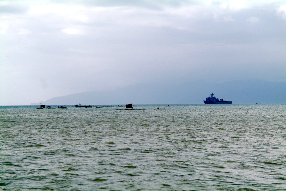 US Navy 060220-N-4772B-086 The U.S. Navy's dock landing ship USS Harpers Ferry (LSD 49) sits anchored offshore while conducting operations supporting local relief efforts on the Island of Leyte