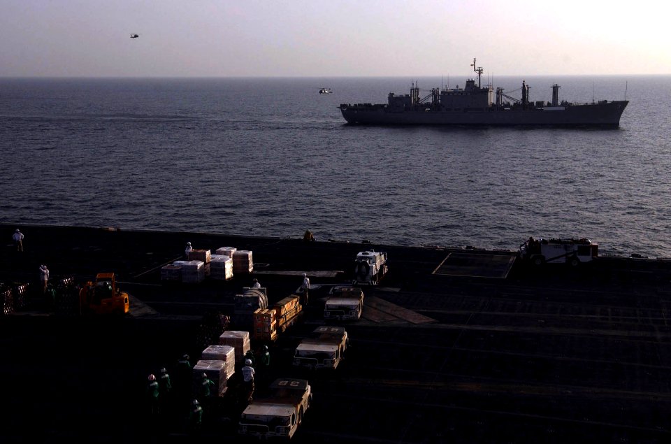 US Navy 060220-N-4776G-182 Helicopters deliver mail, food and other goods from the Military Sealift Command (MSC) combat stores ship USNS Niagara Falls (T-AFS 3) to the Nimitz-class aircraft carrier USS Ronald Reagan (CVN 76) d