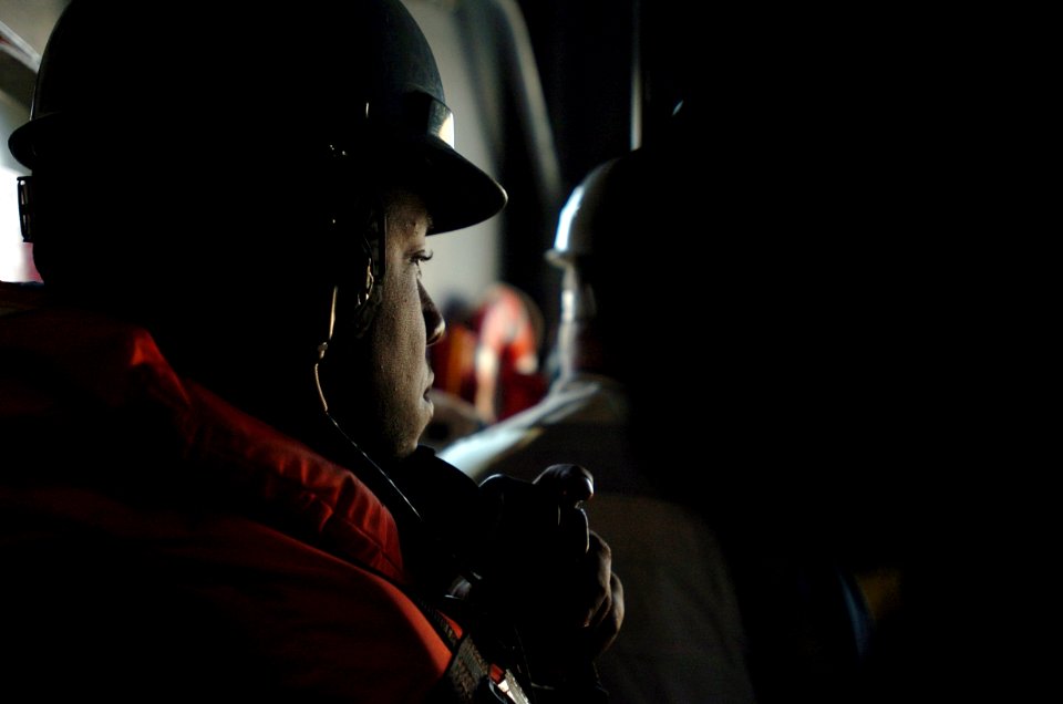 US Navy 060114-N-9866B-024 A Sailor assigned to the Deck Department awaits instructions to relay a message to his shipmates