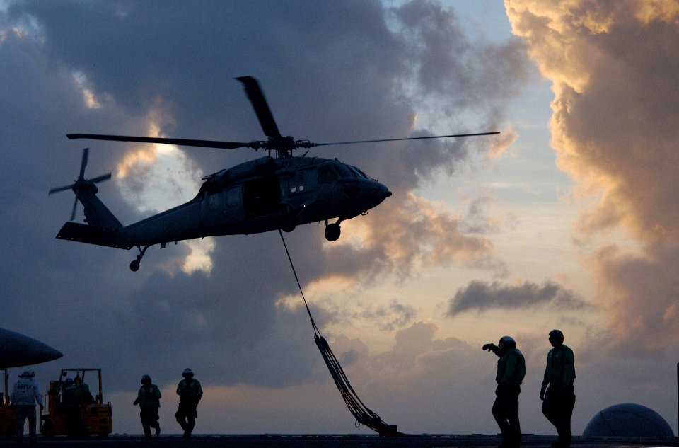 US Navy 060205-N-4776G-428 An MH-60S Seahawk helicopter pick-up cargo pendants from the flight deck aboard the Nimitz-class aircraft carrier USS Ronald Reagan (CVN 76) during a vertical replenishment (VERTREP)