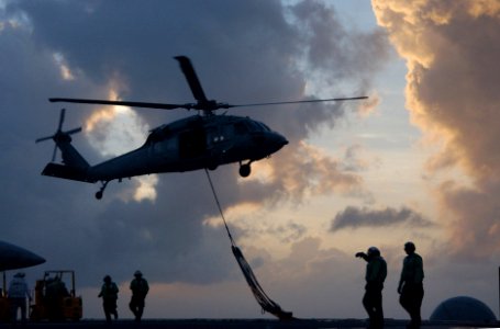 US Navy 060205-N-4776G-428 An MH-60S Seahawk helicopter pick-up cargo pendants from the flight deck aboard the Nimitz-class aircraft carrier USS Ronald Reagan (CVN 76) during a vertical replenishment (VERTREP)