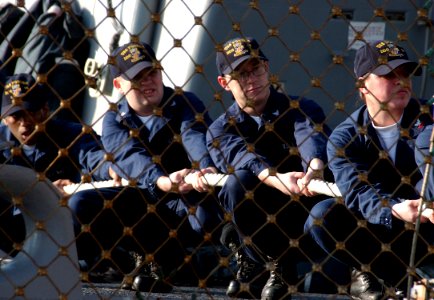 US Navy 060203-N-0780F-007 Sailors aboard the guided-missile destroyer USS Porter (DDG 78) handle lines during mooring operations upon their arrival for a routine port visit