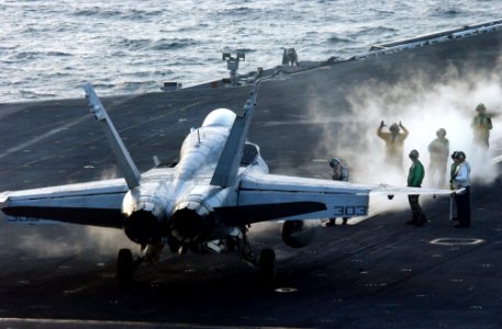 US Navy 060221-N-4776G-044 Aircraft handler prepare to launch an F-A-18C Hornet from the flight deck aboard the Nimitz-class aircraft carrier USS Ronald Reagan (CVN 76)