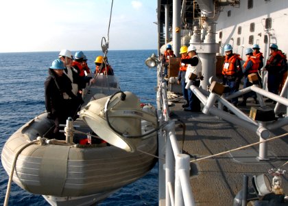 US Navy 060127-N-7526R-029 Sailors from the amphibious command ship USS Blue Ridge (LCC 19) deck department lower a Rigged Hull Inflatable Boat (RHIB) and it's crew down into the water as a safety precaution