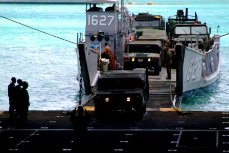US Navy 060209-N-4772B-237 The amphibious dock landing ship USS Harpers Ferry (LSD 49) Sailors direct equipment assigned to the 31st Marine Expeditionary Unit (MEU) into the well deck