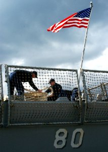 US Navy 060208-N-0780F-010 Sailors assigned to the guided-missile destroyer USS Roosevelt (DDG 80) conduct mooring operations
